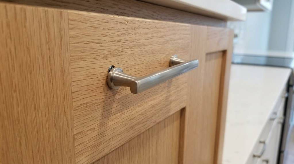 Properly aligned kitchen cabinet hardware after repair